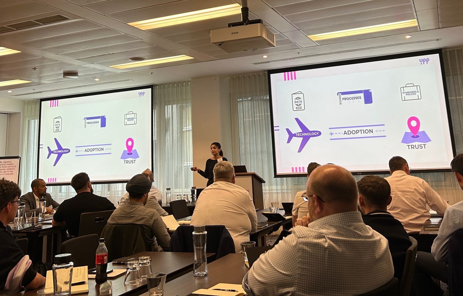 Khyati Pal speaking at an AI workshop about technology, adoption, trust, processes, data and standards